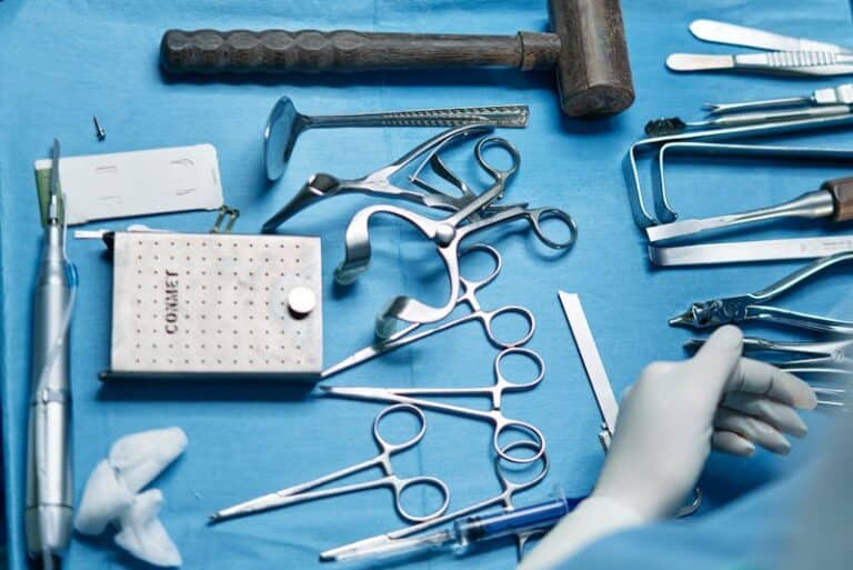 Surgical instruments including a bone mallet arranged on a blue drape