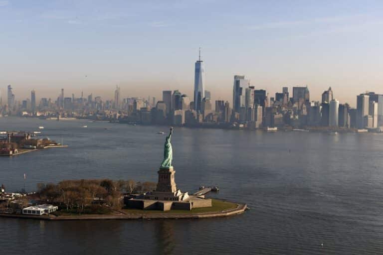 The Statue of Liberty with the Lower Manhattan skyline behind it